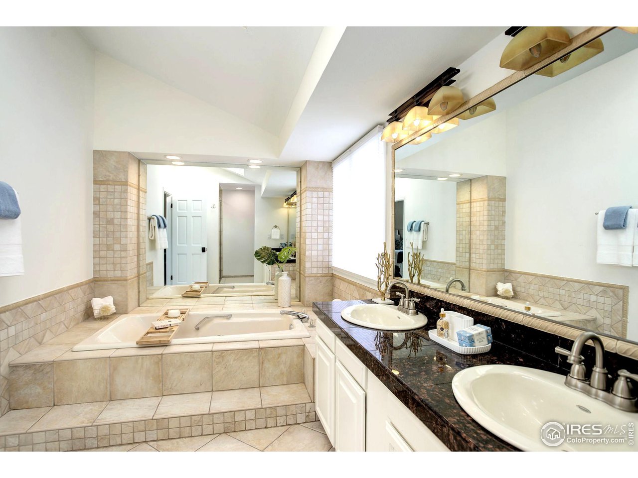 7240 Clubhouse Road Boulder, CO 80301 - Photo 21 of 34 a bathroom with a granite countertop sink mirror and