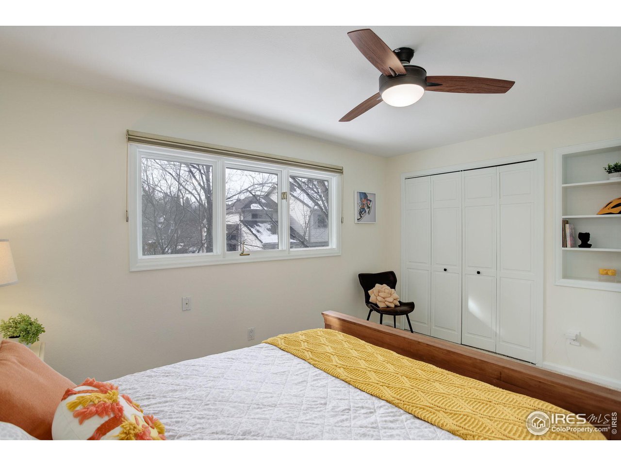 7240 Clubhouse Road Boulder, CO 80301 - Photo 23 of 34 a bedroom with a bed and wooden floor