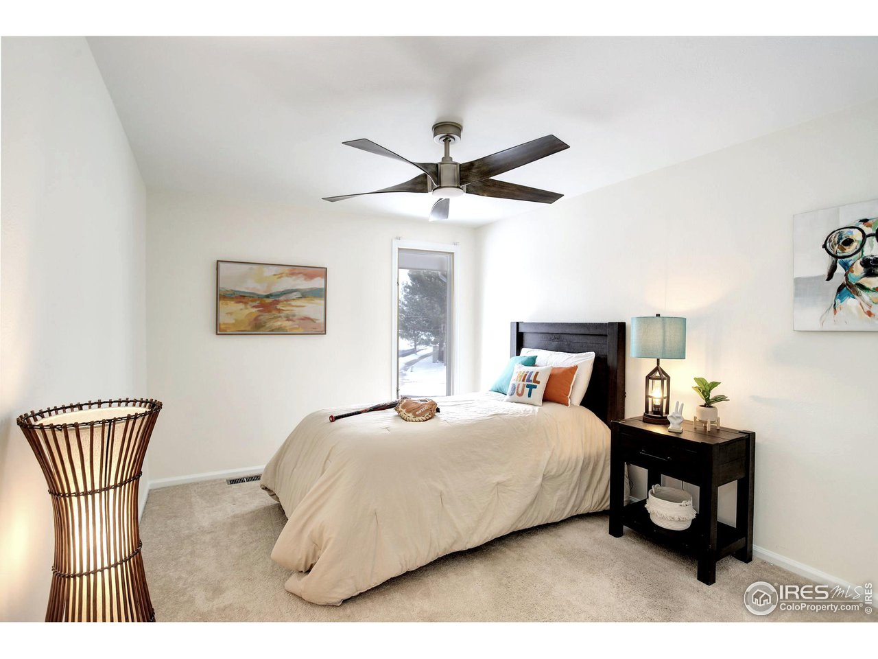 7240 Clubhouse Road Boulder, CO 80301 - Photo 25 of 34 a bedroom with a bed and a chandelier