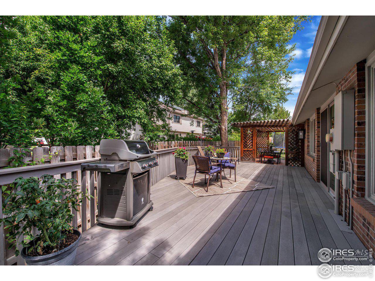7240 Clubhouse Road Boulder, CO 80301 - Photo 29 of 34 a view of backyard with seating space and trees