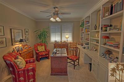 49145 Rio Arenoso La Quinta, CA 92253 - Photo 12 of 18 a living room with furniture a chandelier and a window