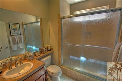 49145 Rio Arenoso La Quinta, CA 92253 - Photo 14 of 18 a bathroom with a sink mirror vanity and toilet