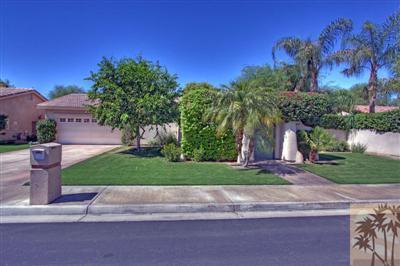 49145 Rio Arenoso La Quinta, CA 92253 - Photo 18 of 18 a front view of a house with a yard and garage