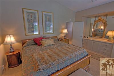 49145 Rio Arenoso La Quinta, CA 92253 - Photo 10 of 18 a bedroom with a bed and window
