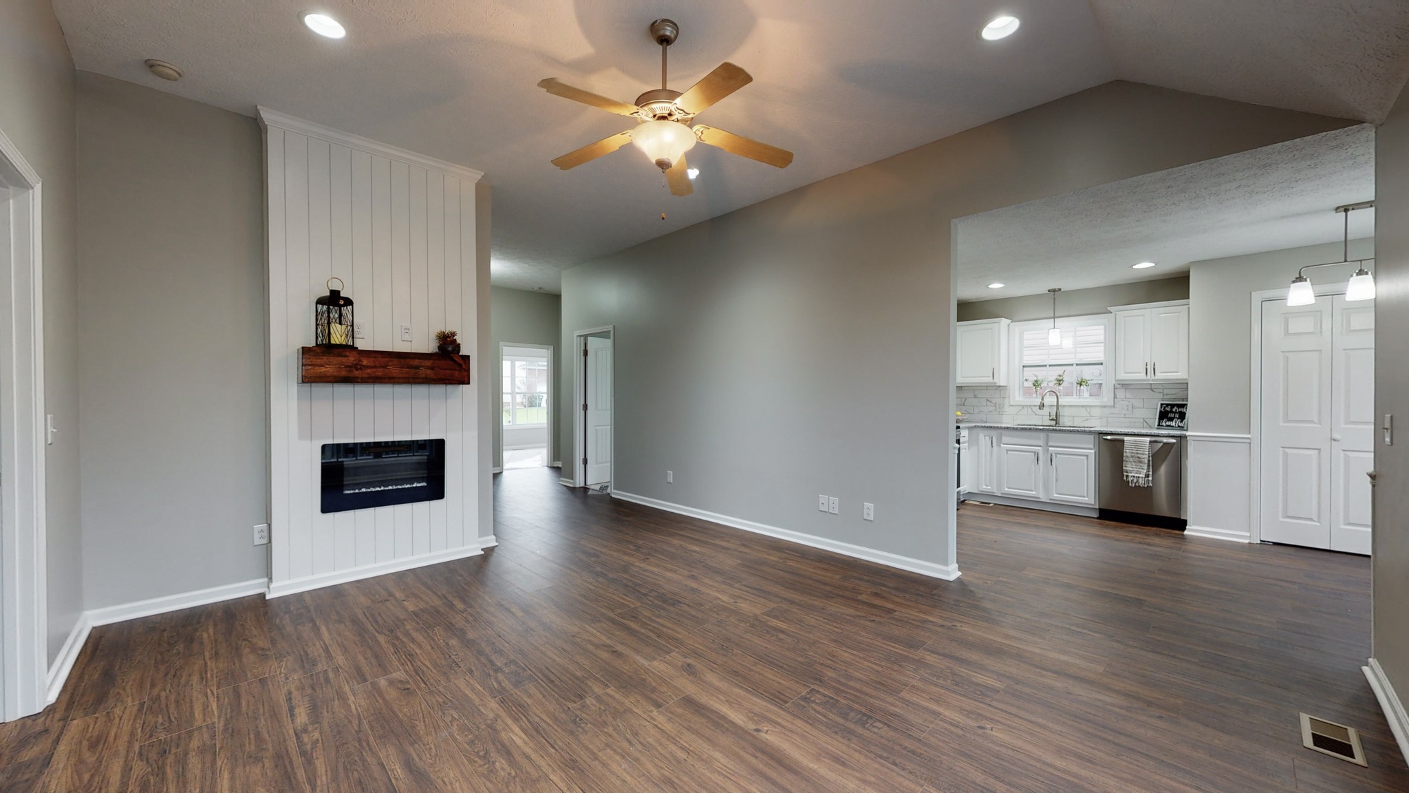 443 Berry Circle Springfield, TN 37172 - Photo 3 of 19 a view of a kitchen with a sink a fireplace and a window