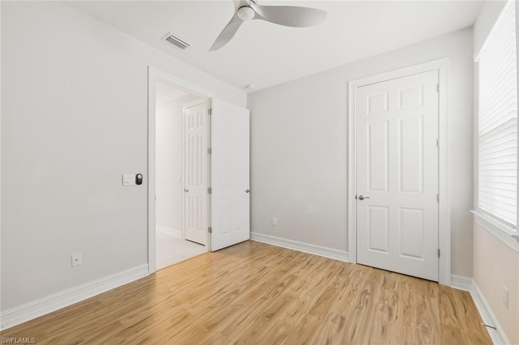 28310 Captiva Shell Loop Bonita Springs, FL 34135 - Photo 18 of 44 Unfurnished bedroom featuring light wood-style floors and ceiling fan