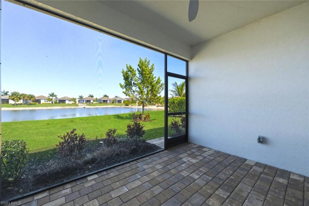 28310 Captiva Shell Loop Bonita Springs, FL 34135 - Photo 24 of 44 Unfurnished sunroom featuring a water view and a residential view