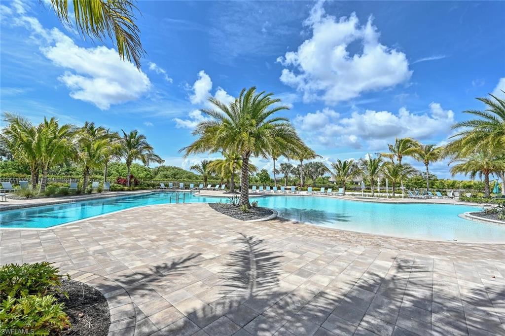 28310 Captiva Shell Loop Bonita Springs, FL 34135 - Photo 33 of 44 Community pool featuring a patio area