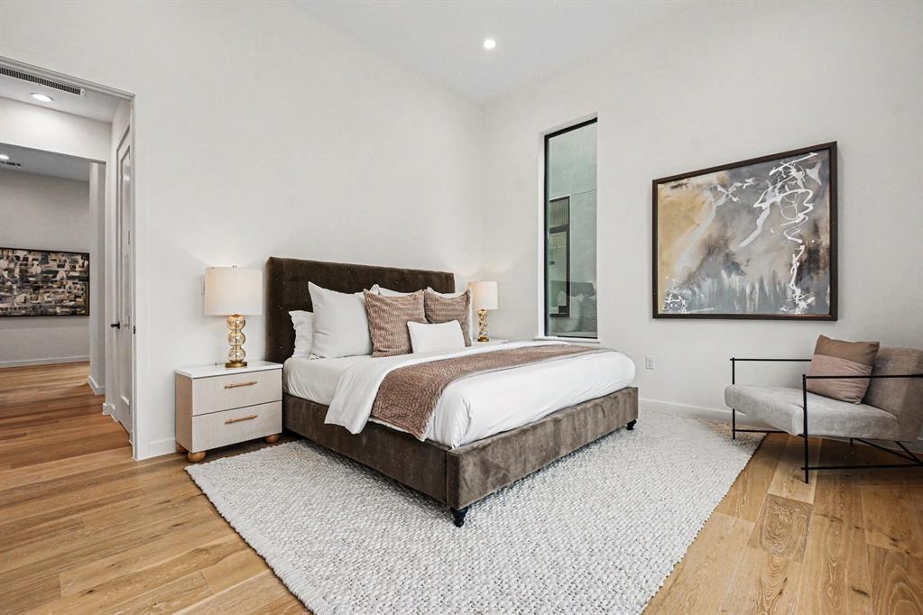 1111 Raiford Road, Unit 121 Carrollton, TX 75007 - Photo 11 of 30 a spacious bedroom with a bed and a couch