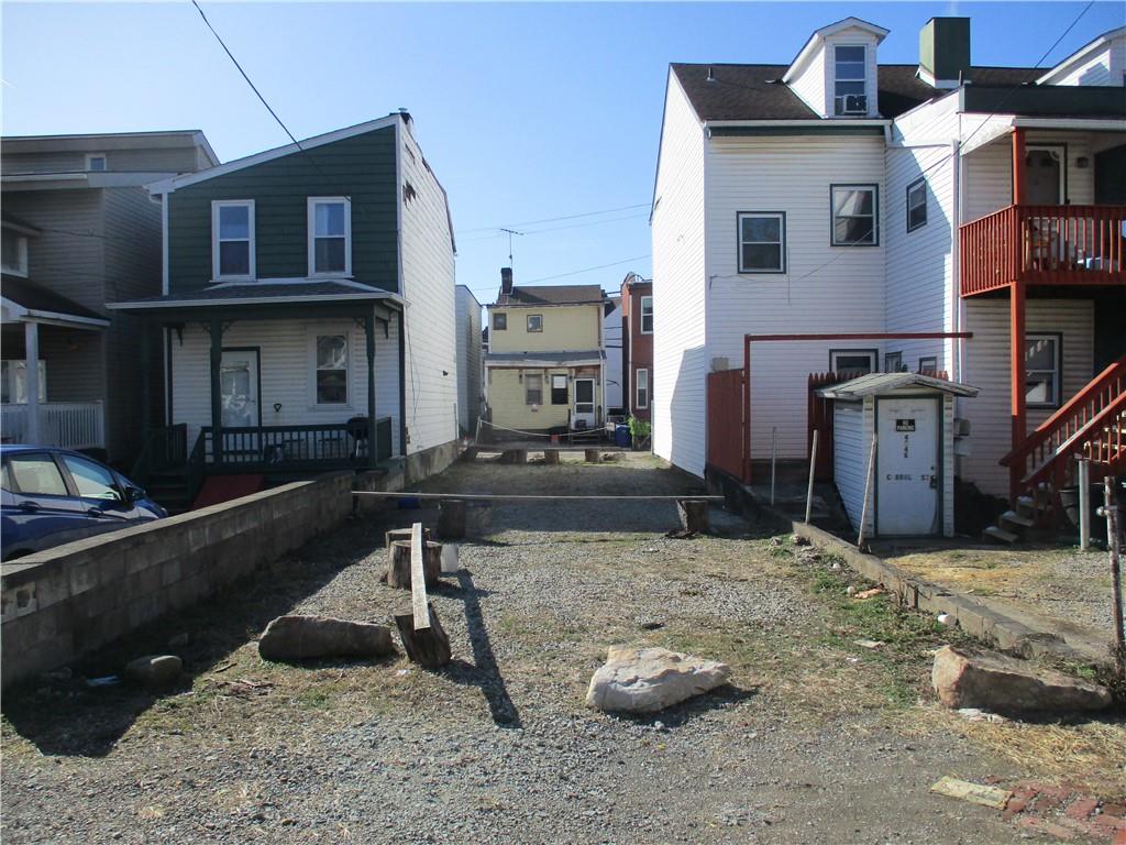 4550 Carroll Street Pittsburgh, PA 15224 - Photo 1 of 4 a view of a chairs and table in backyard