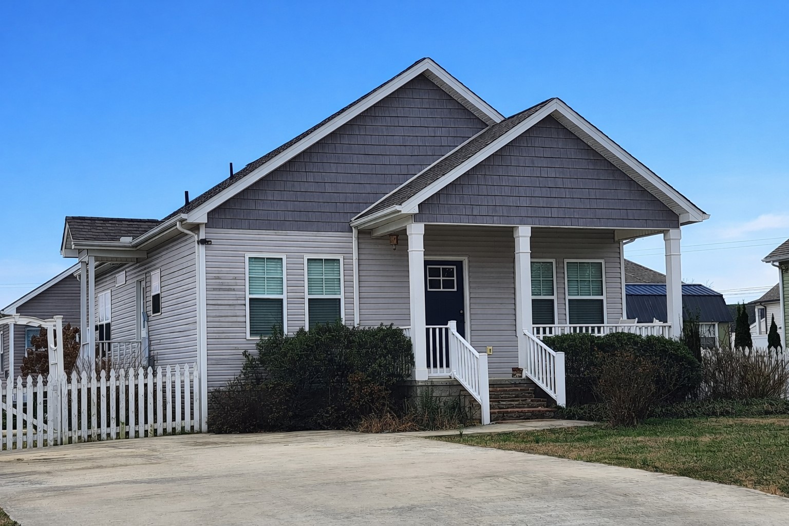 a front view of a house with garage