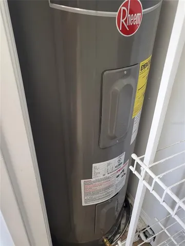 a front view of a house with yard and parking