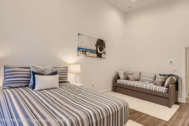 a bedroom with bed and window