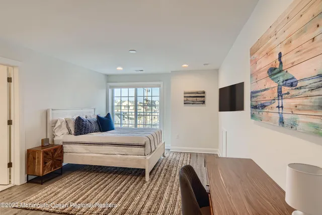 a bedroom with furniture and a window