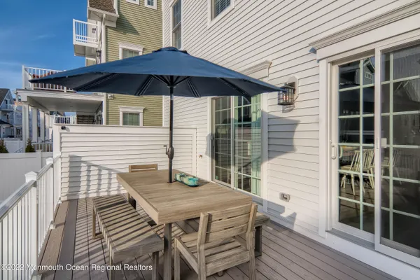 a view of a roof deck with wooden floor