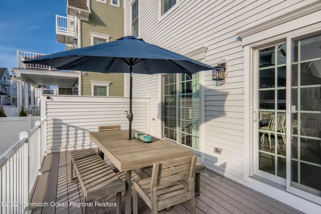 a view of a roof deck with wooden floor