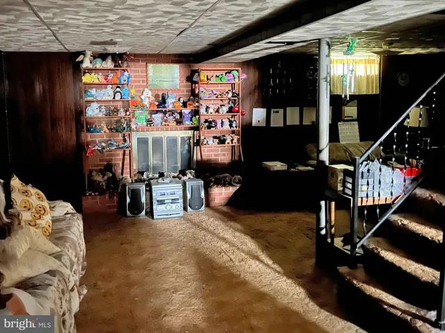 a view of a livingroom with furniture and toys