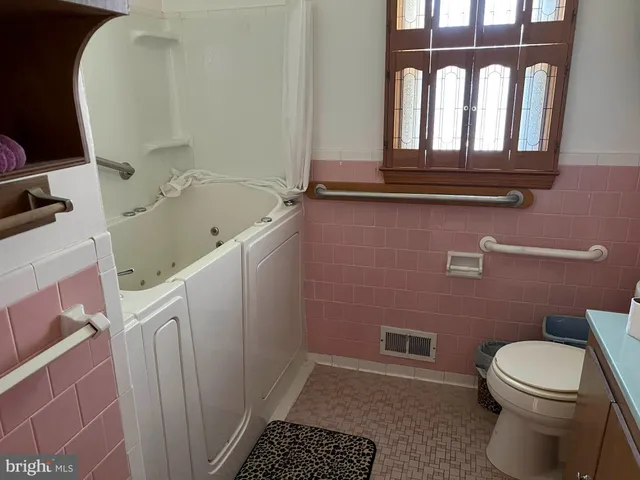 a bathroom with a toilet and a sink