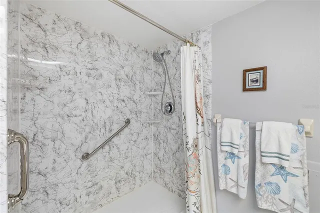 a bathroom with a shower curtain