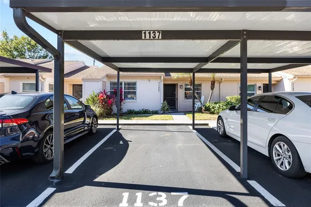 an aerial view of a house with a swimming pool