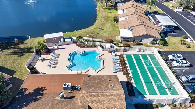 an aerial view of a house with a swimming pool