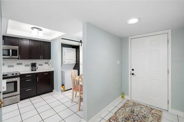 a spacious bathroom with a sink a mirror and a bathtub