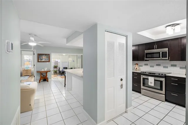 a kitchen with stainless steel appliances a stove microwave and cabinets
