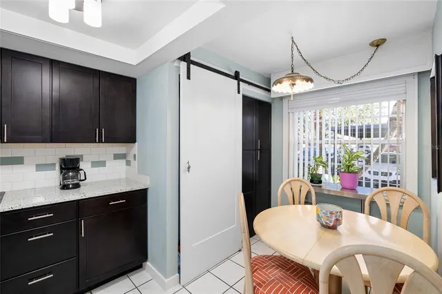 a view of a dining room with furniture window and outside view