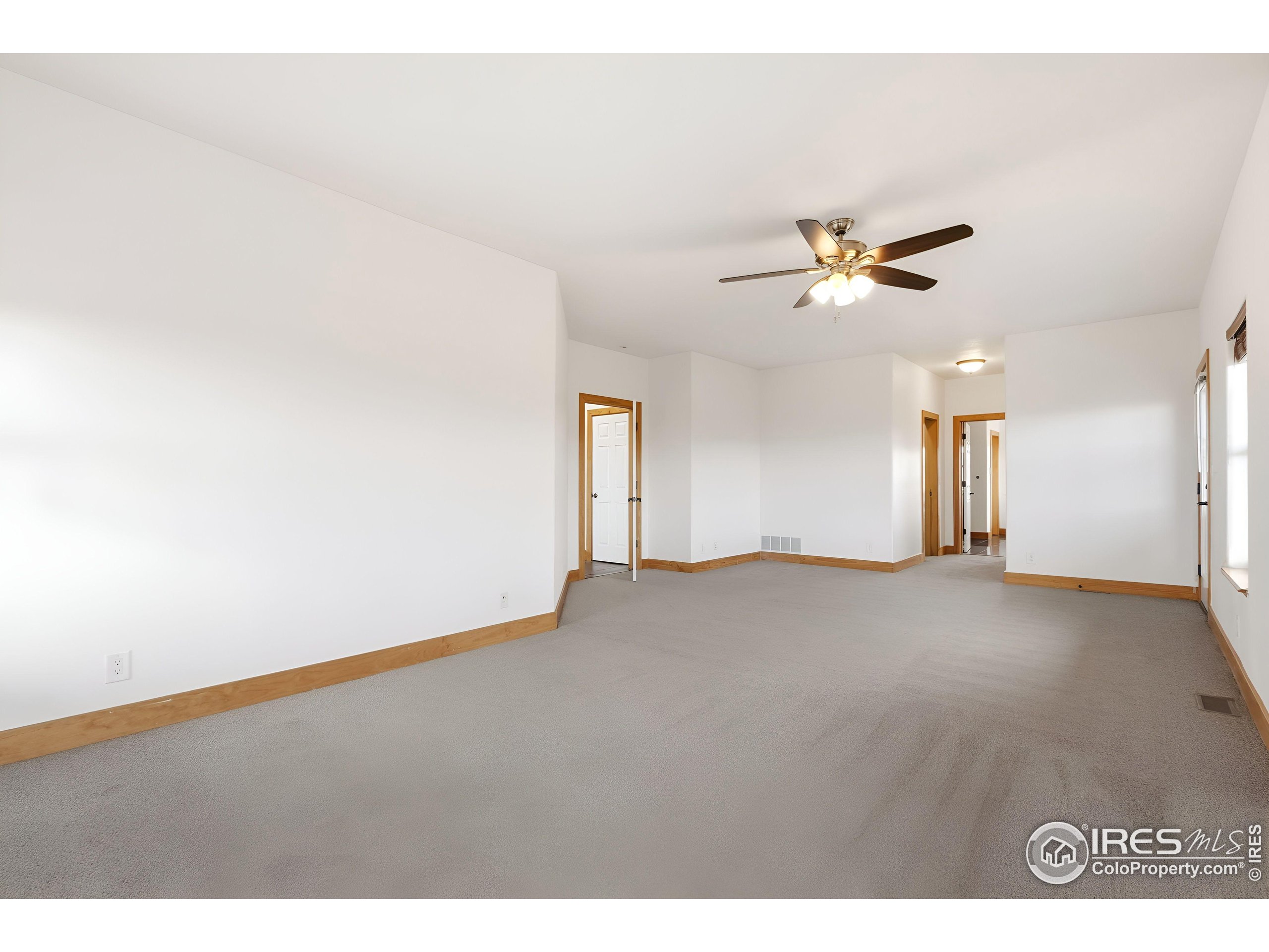 7321 Gilmore Avenue Fort Collins, CO 80524 - Photo 18 of 37 a view of an empty room with a ceiling fan