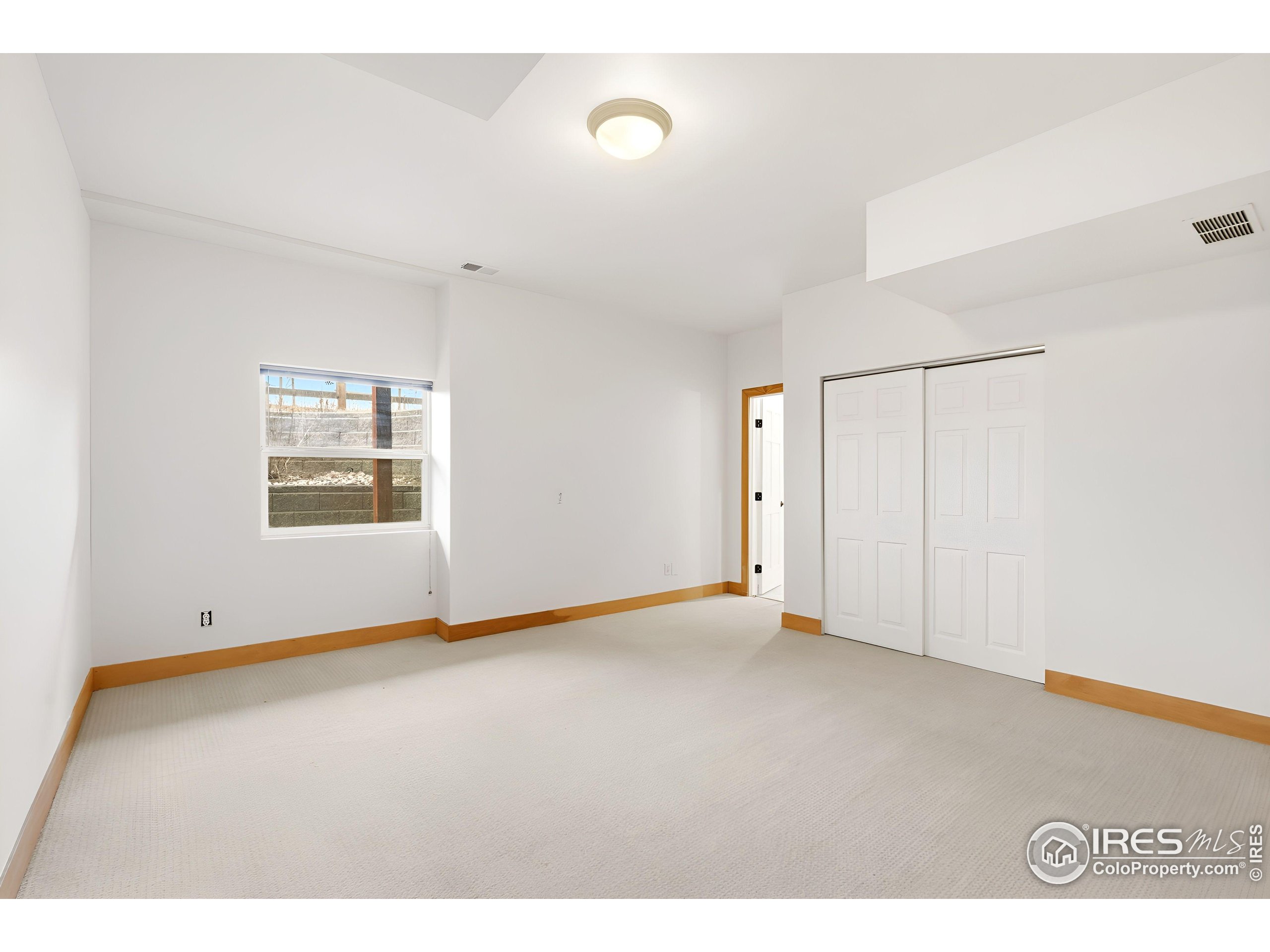 7321 Gilmore Avenue Fort Collins, CO 80524 - Photo 24 of 37 a view of an empty room with a window