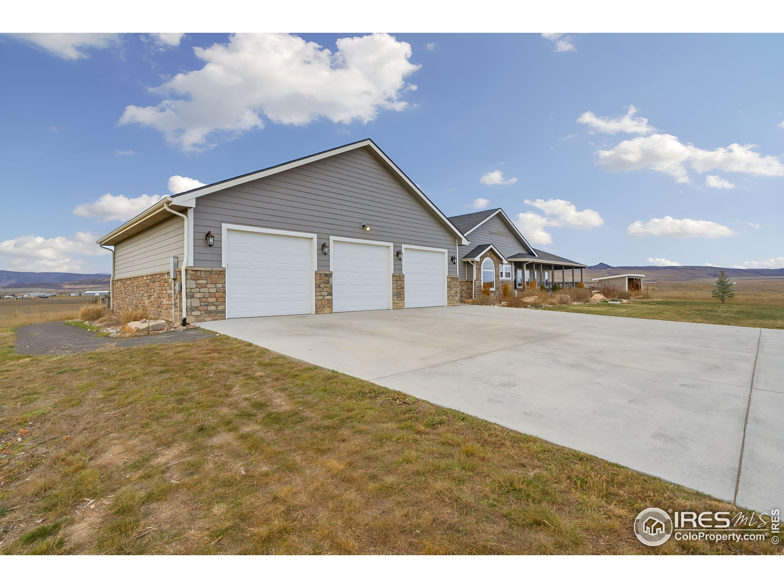 7321 Gilmore Avenue Fort Collins, CO 80524 - Photo 3 of 37 a view of an house with backyard and road