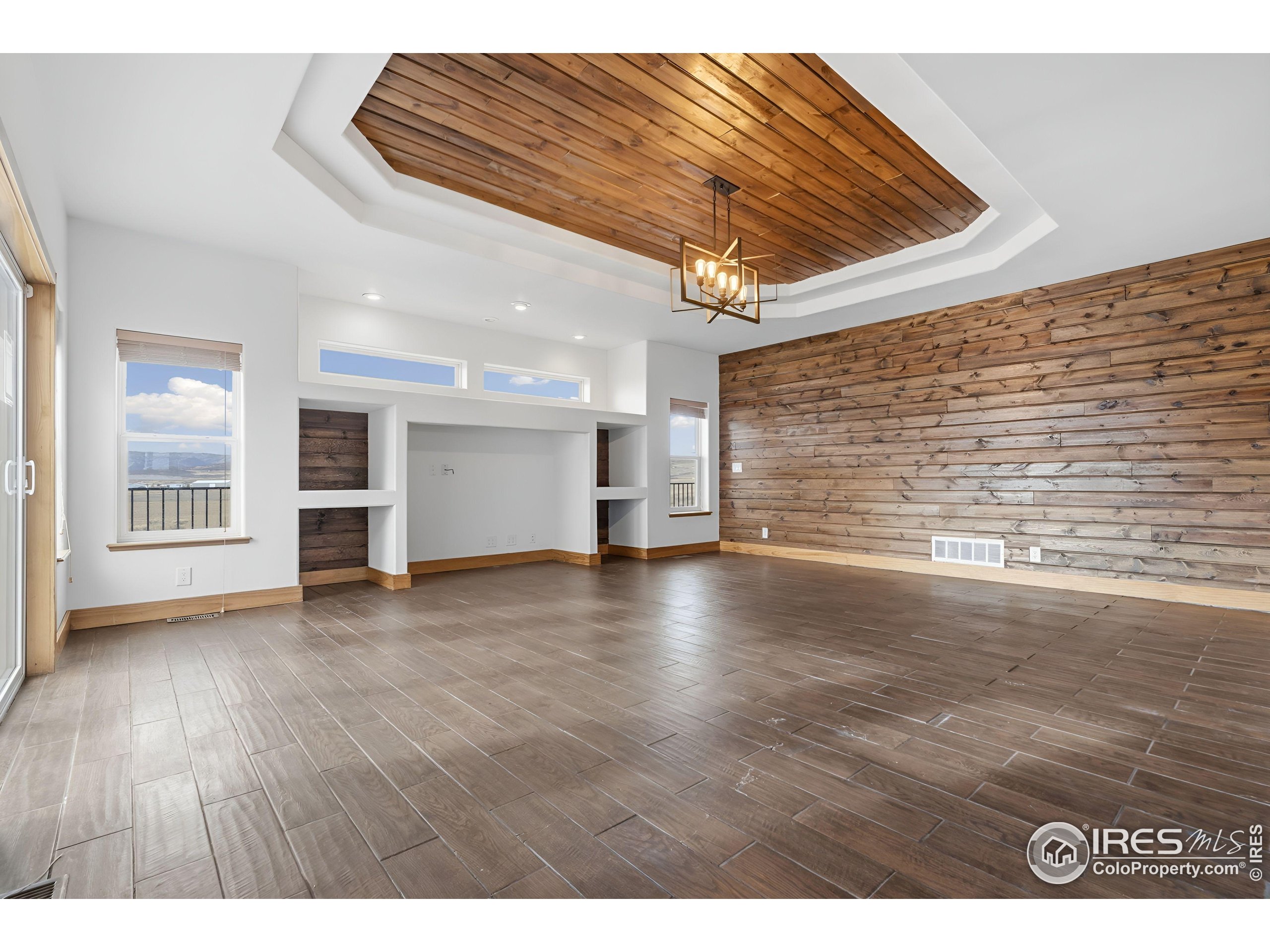 7321 Gilmore Avenue Fort Collins, CO 80524 - Photo 9 of 37 a view of a livingroom with wooden floor