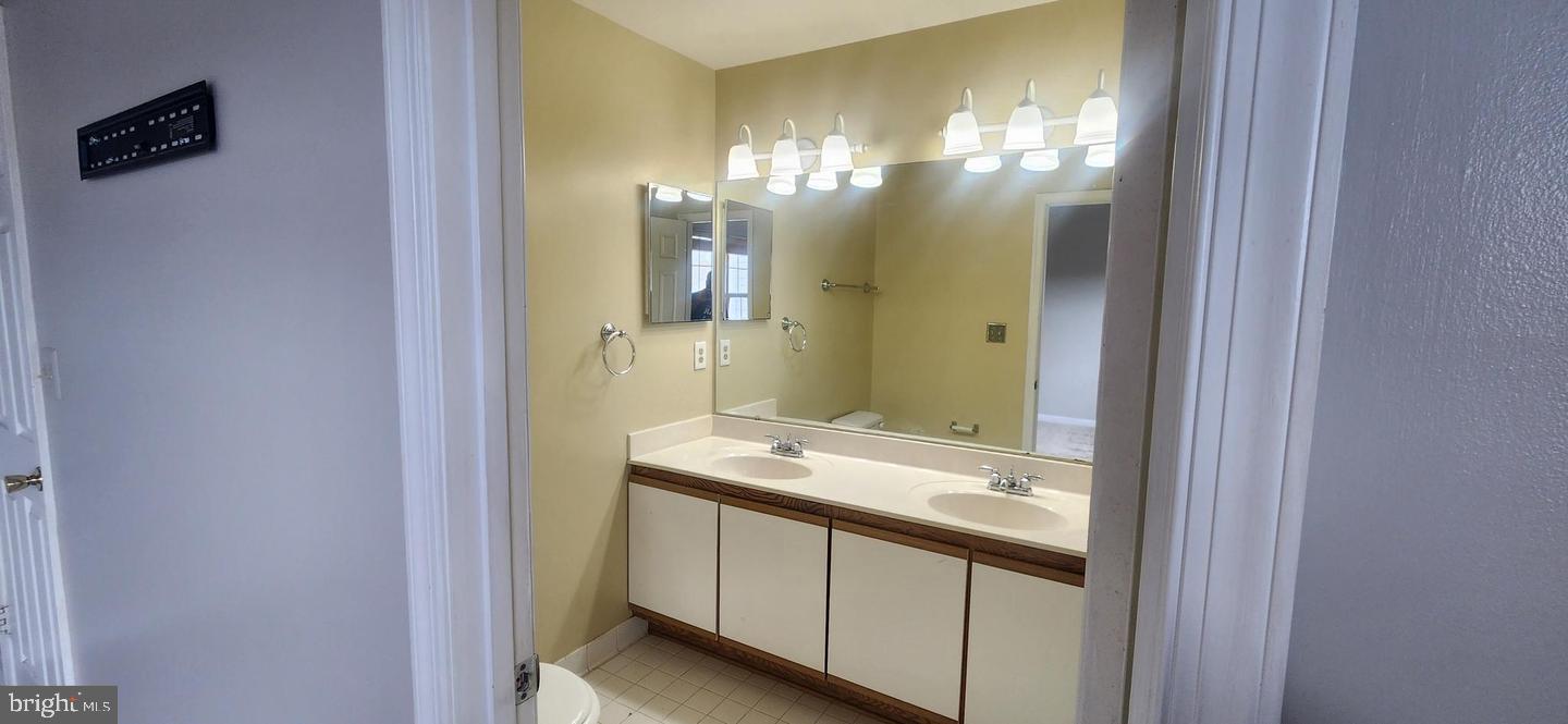 55 Powder View Court Nottingham, MD 21236 - Photo 11 of 20 a bathroom with a sink and a mirror