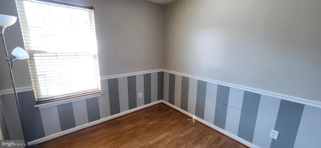 a view of wooden floor and a window