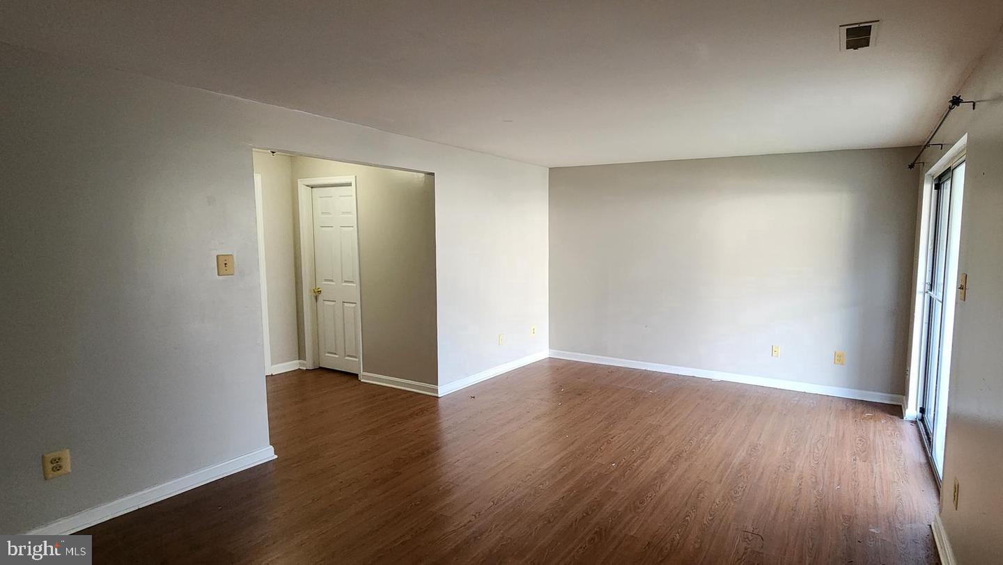 55 Powder View Court Nottingham, MD 21236 - Photo 18 of 20 an empty room with wooden floor and closet