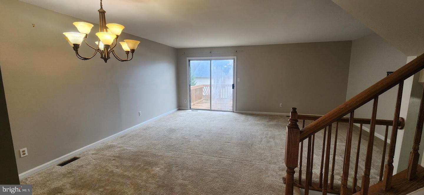 55 Powder View Court Nottingham, MD 21236 - Photo 2 of 20 a view of a chandelier fan and wooden floor