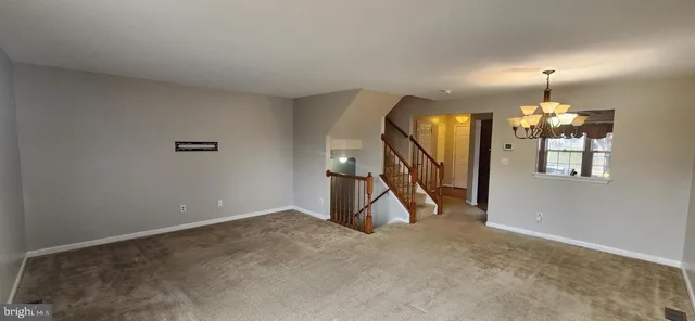 a view of a livingroom with a staircase