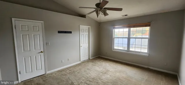 a view of empty room with windows