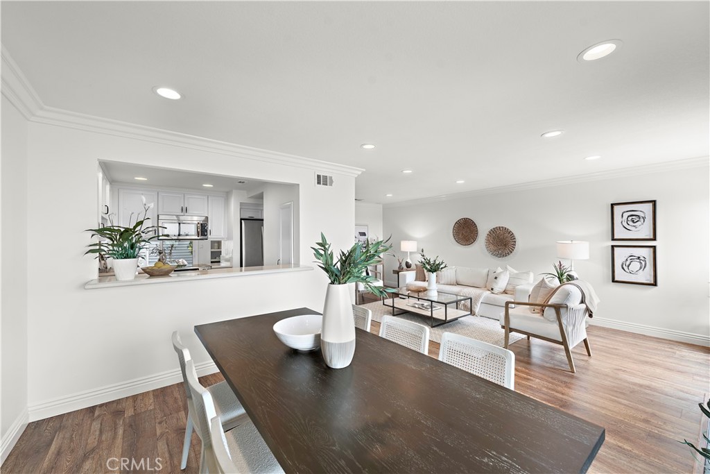 24592 Harbor View Drive, Unit B Dana Point, CA 92629 - Photo 12 of 33 a view of a dining room with furniture and wooden floor