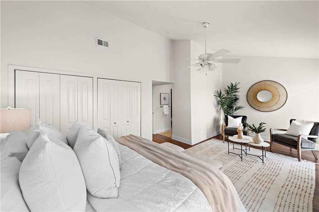 24592 Harbor View Drive, Unit B Dana Point, CA 92629 - Photo 20 of 33 a bedroom with a bed and chandelier