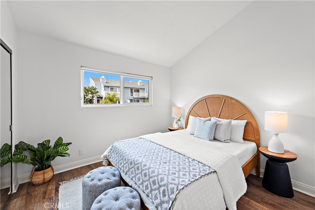 24592 Harbor View Drive, Unit B Dana Point, CA 92629 - Photo 26 of 33 a bedroom with a bed and a potted plant