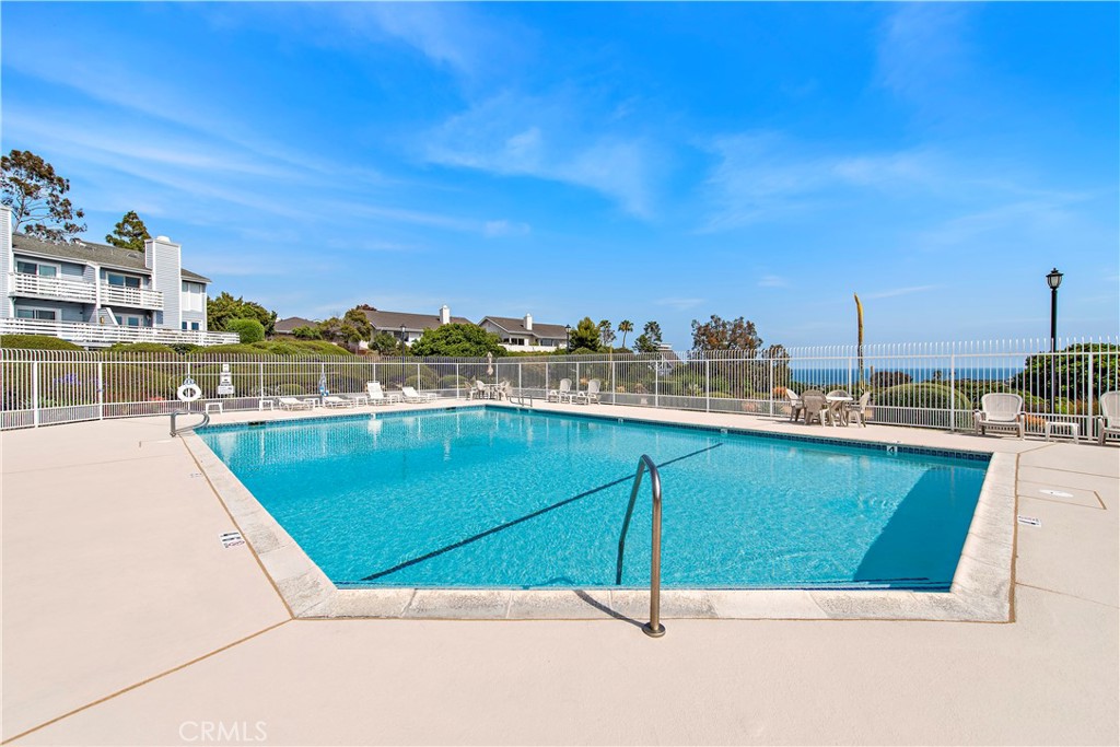 24592 Harbor View Drive, Unit B Dana Point, CA 92629 - Photo 28 of 33 a view of a swimming pool with a chairs