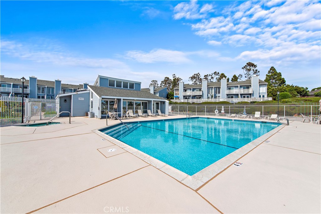 24592 Harbor View Drive, Unit B Dana Point, CA 92629 - Photo 29 of 33 a view of a swimming pool with a terrace