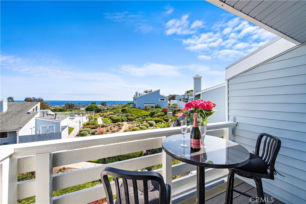 24592 Harbor View Drive, Unit B Dana Point, CA 92629 - Photo 3 of 33 a view of a dining table and chairs in the balcony