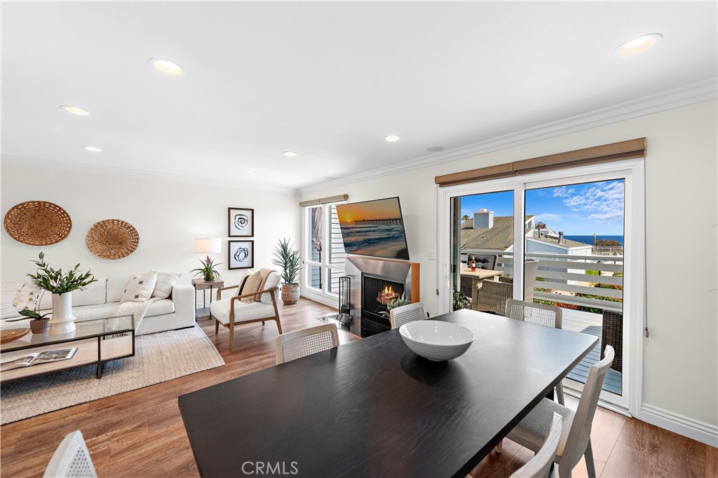 24592 Harbor View Drive, Unit B Dana Point, CA 92629 - Photo 5 of 33 a living room with dining room and couches chair with wooden floor