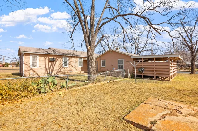 a house with trees in the background