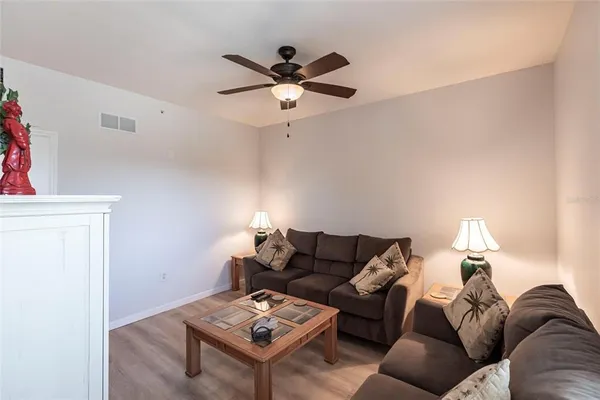 a living room with furniture and a table