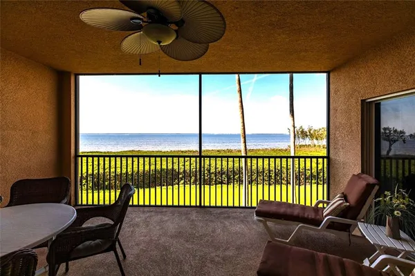 a view of a balcony with furniture