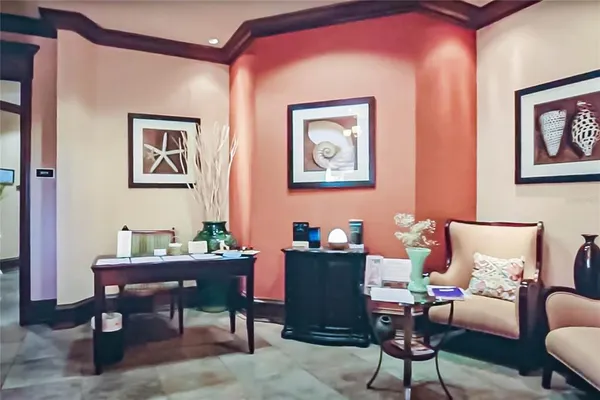 a view of a room with lots of gym equipment