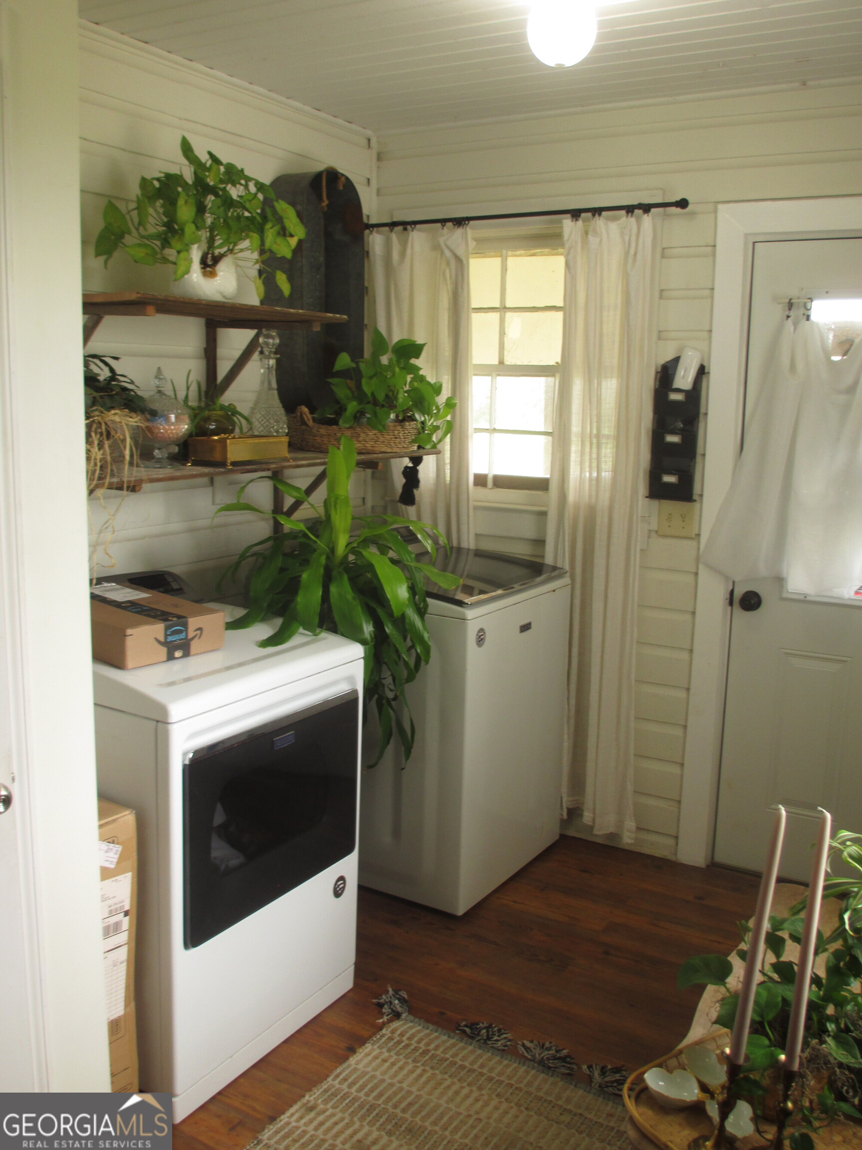 84 Comer Yawn Road Hazlehurst, GA 31539 - Photo 11 of 24 a view of hallway with washer and dryer